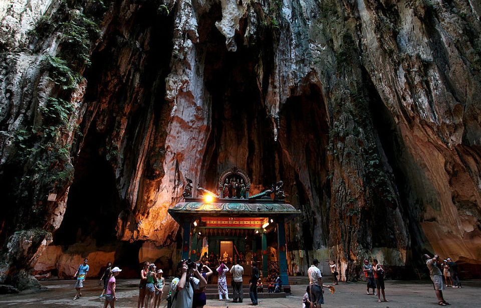 Tourists walking around the Batu Caves