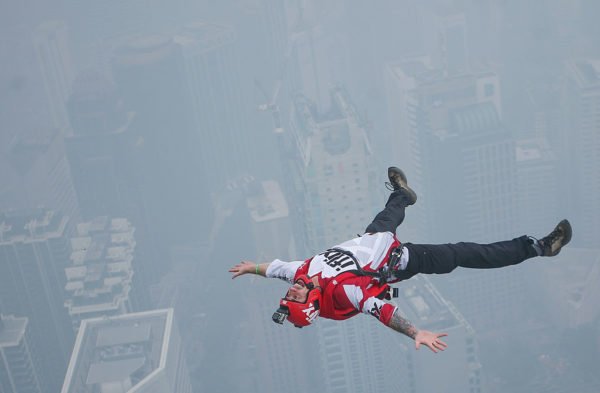 BASE jumper lying on his back while falling through the air