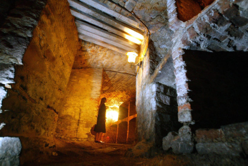Woman standing inside the Edinburgh Vaults