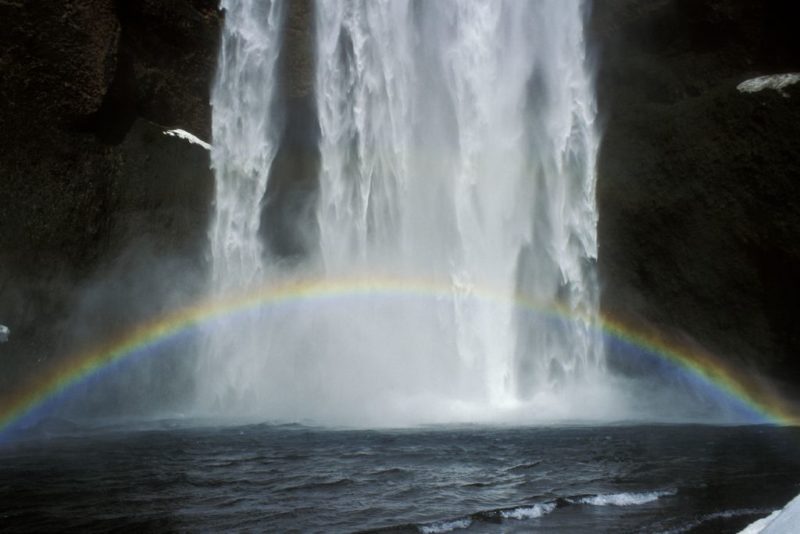Rainbow passing through Skógafoss Falls