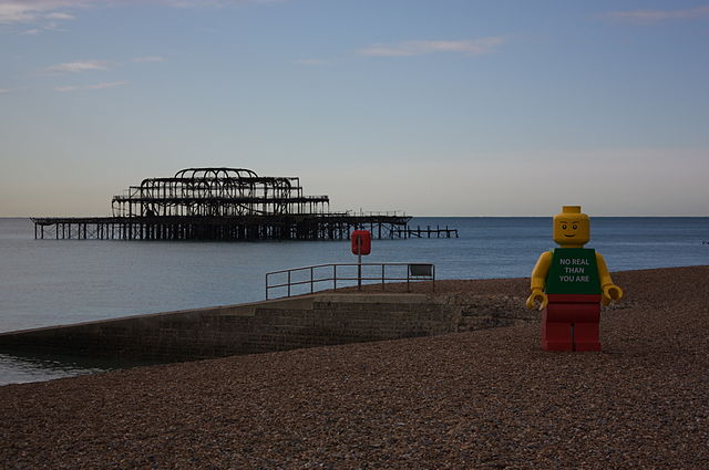 Giant LEGO man standing on Brighton Beach