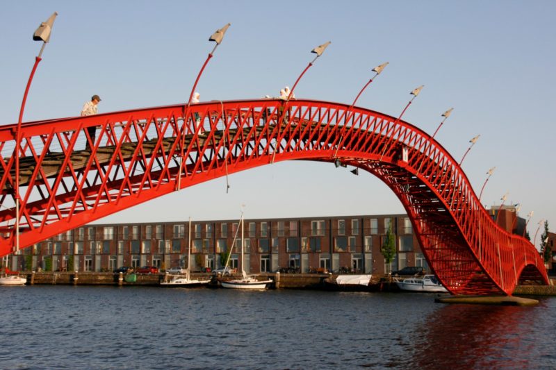 Man standing on the High Bridge in Amsterdam, Netherlands