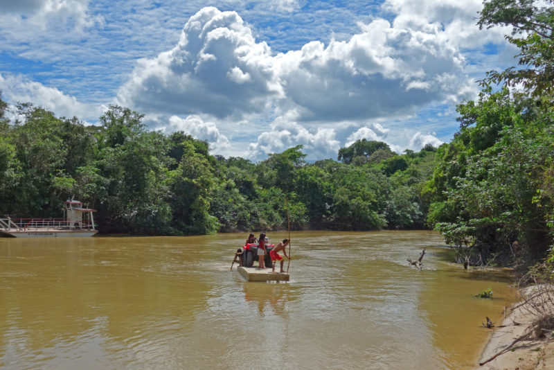 Members of the Awá Tribe paddling across the Pindaré River