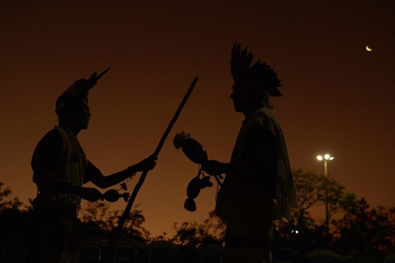 Two Indigenous Men standing at sunset