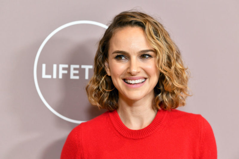 Natalie Portman smiling on a red carpet