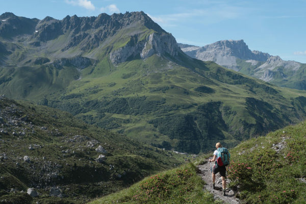 Hiker walking along a mountain trail