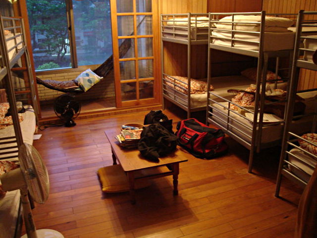 Hostel dormitory with bunkbeds along the walls