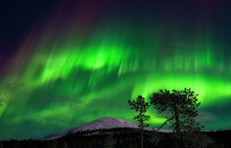 Northern Lights shining over a mountain