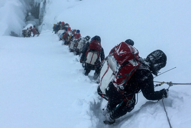 Mountaineers lined up along Mount Everest