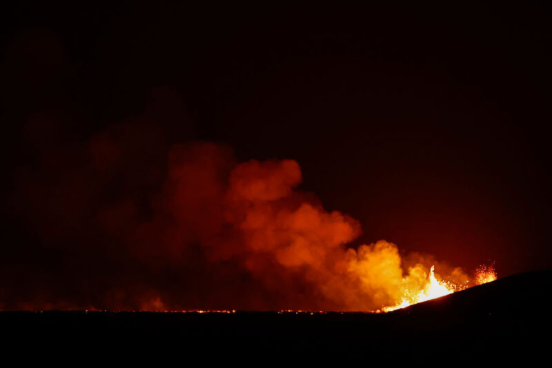 Lava and smoke rising into the air from the Fagradalsfjall volcano