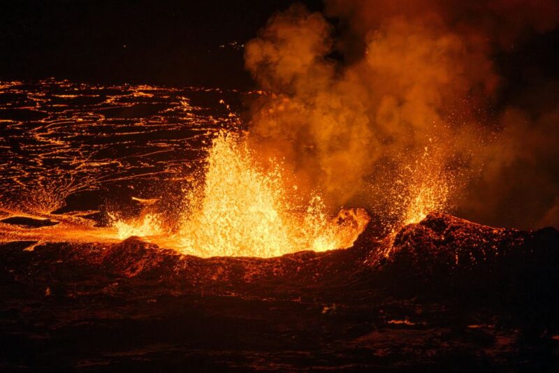 Lava rising into the air and streaming across the ground