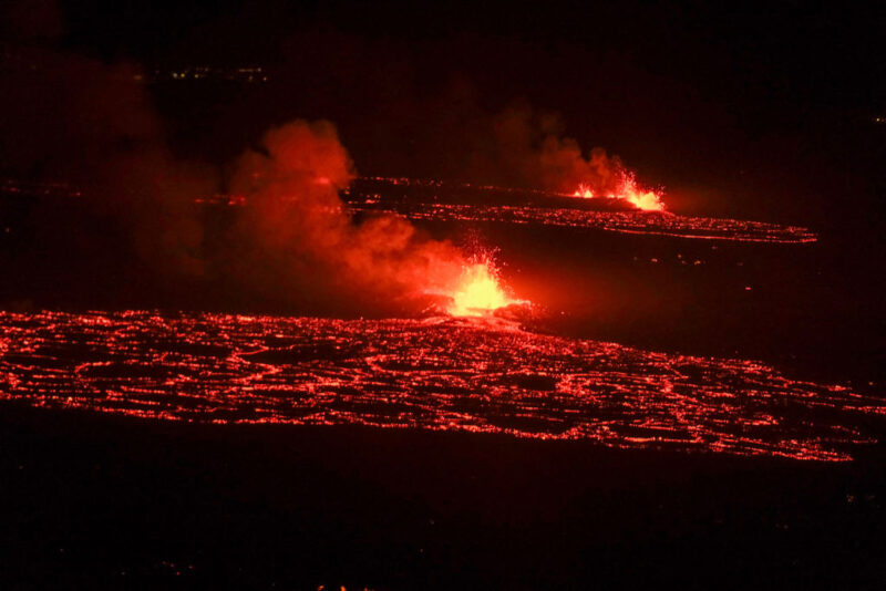 Lava rising into the air and flowing across the ground from the Fragadalsfjall volcano